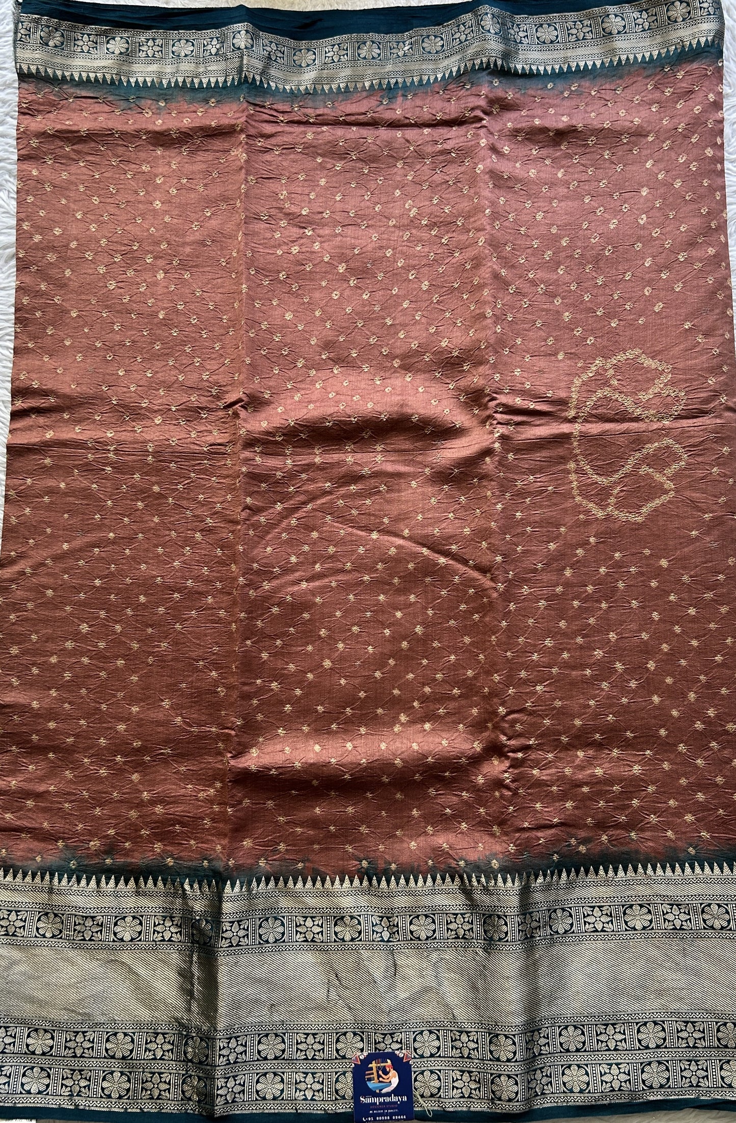 Bandhani Saree Rust Colored Elegantly Paired with a Teal Blue Color Zari Border. - Sampradaya Designer Studio