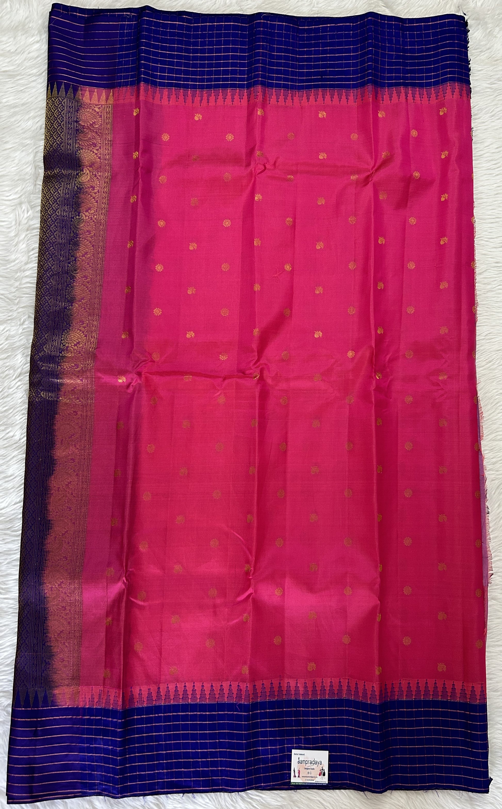Gadwal Pattu Saree Pink colored saree complemented with a Dark Blue Checks Border - Sampradaya Designer Studio