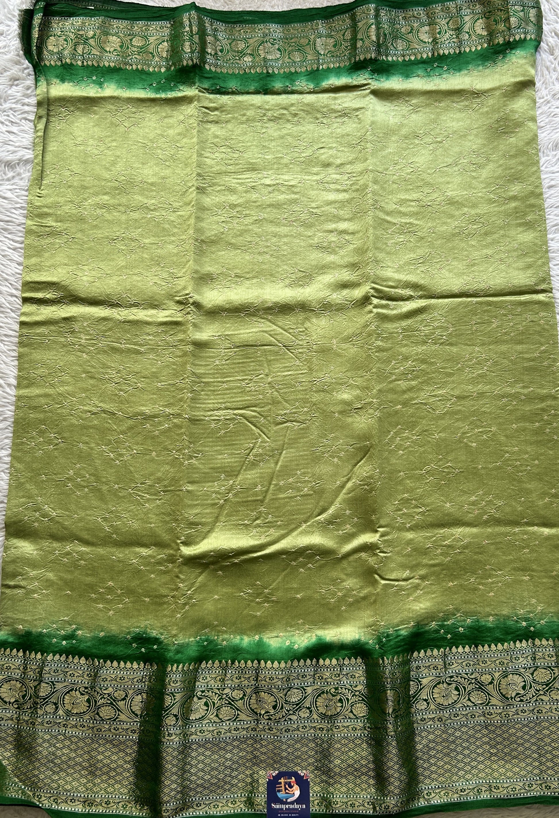 Bandhani Saree Inchworm Colored Elegantly Paired with a Green Color Zari Border. - Sampradaya Designer Studio