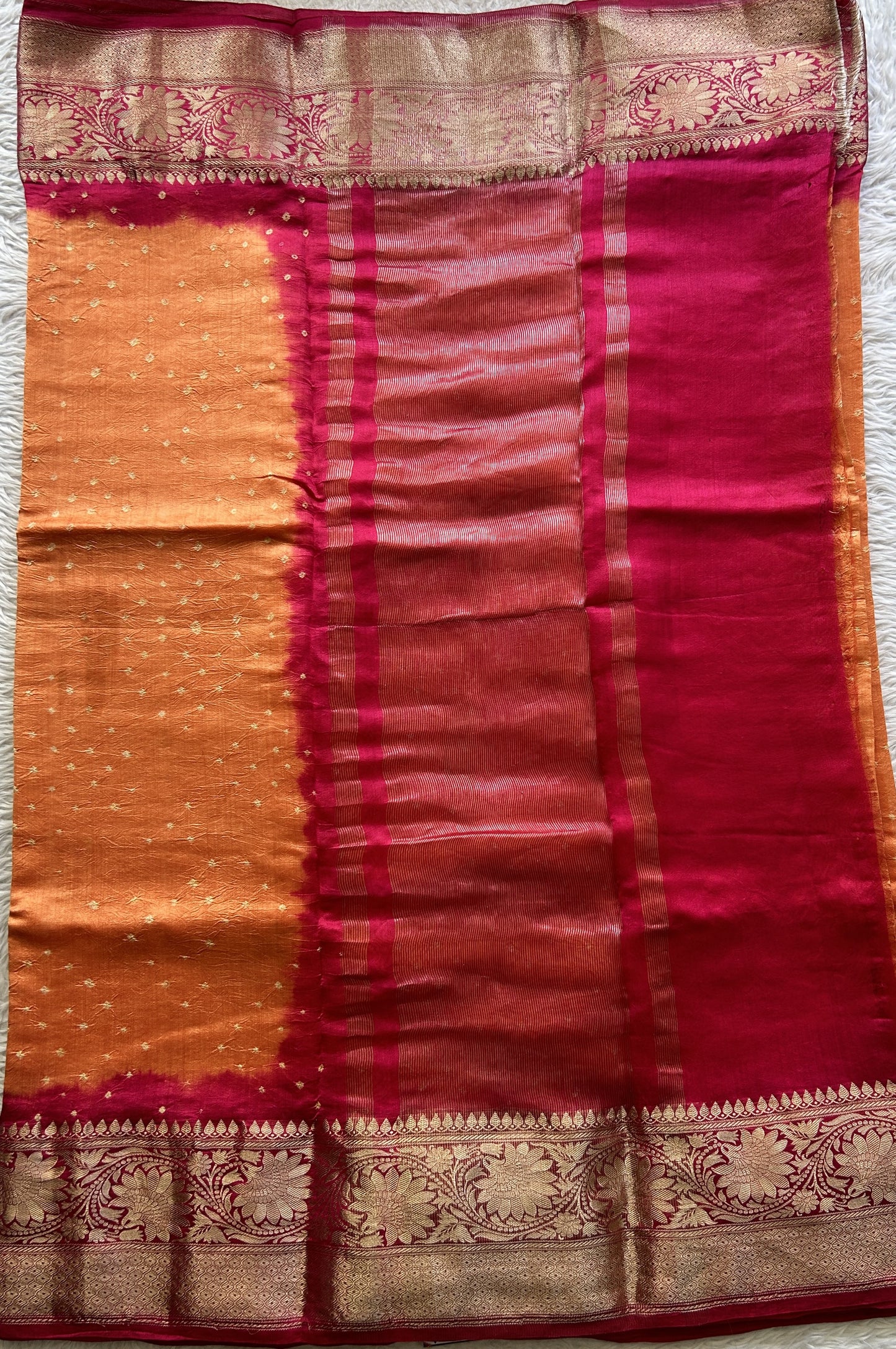 Bandhani Saree Orange Colored Elegantly Paired with a Dark Pink Color Zari Border. - Sampradaya Designer Studio