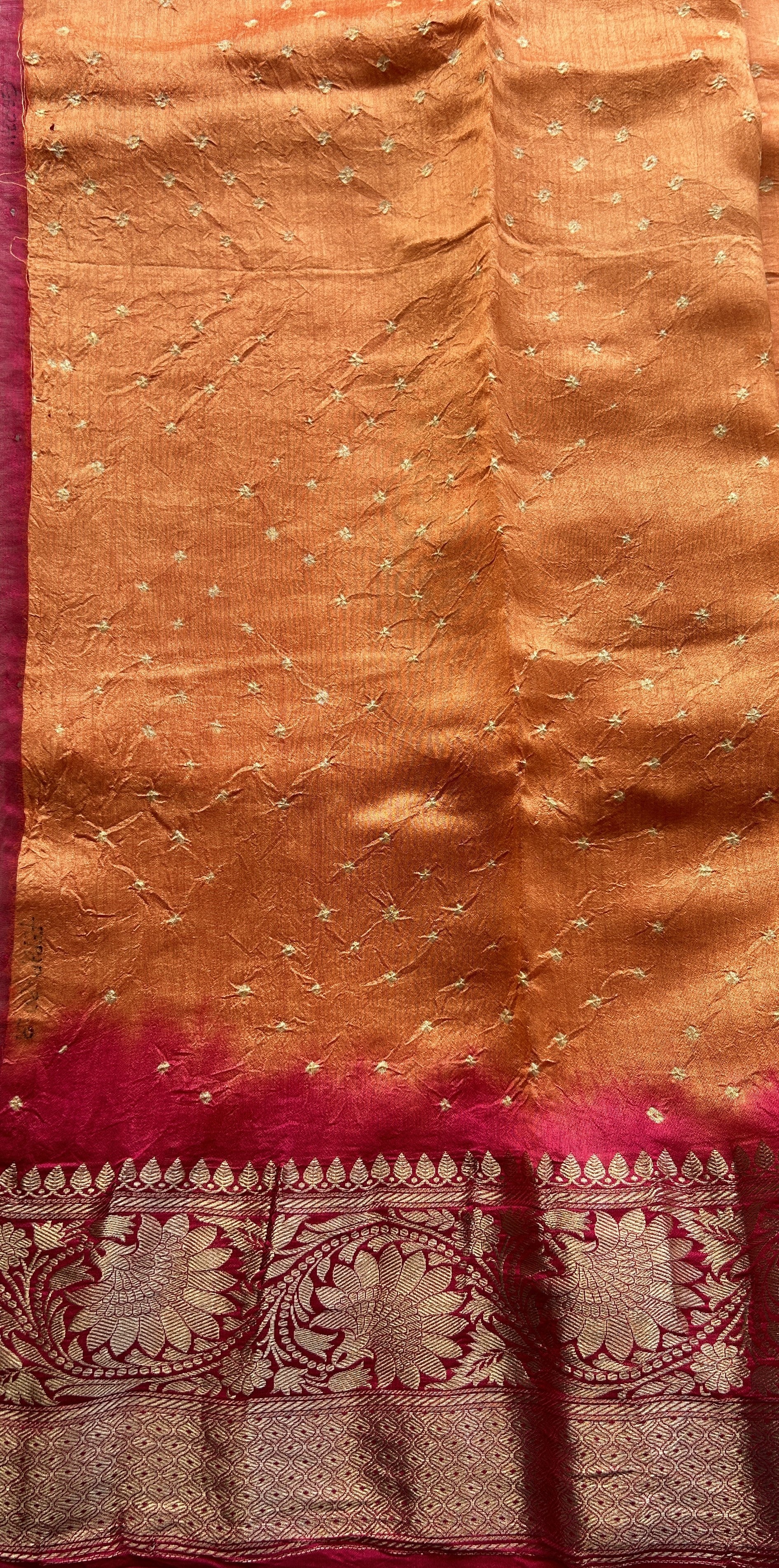 Bandhani Saree Orange Colored Elegantly Paired with a Dark Pink Color Zari Border. - Sampradaya Designer Studio