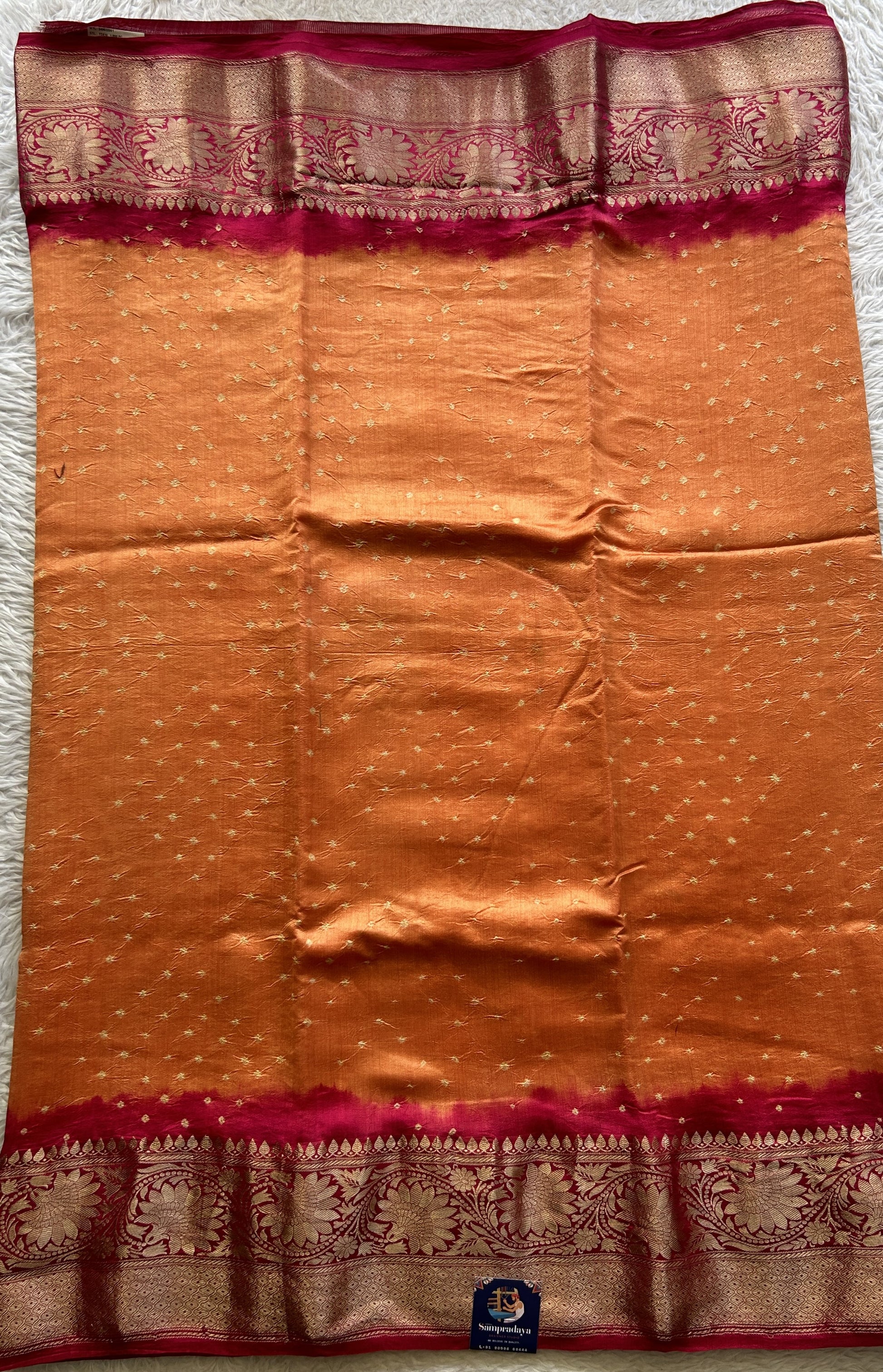 Bandhani Saree Orange Colored Elegantly Paired with a Dark Pink Color Zari Border. - Sampradaya Designer Studio