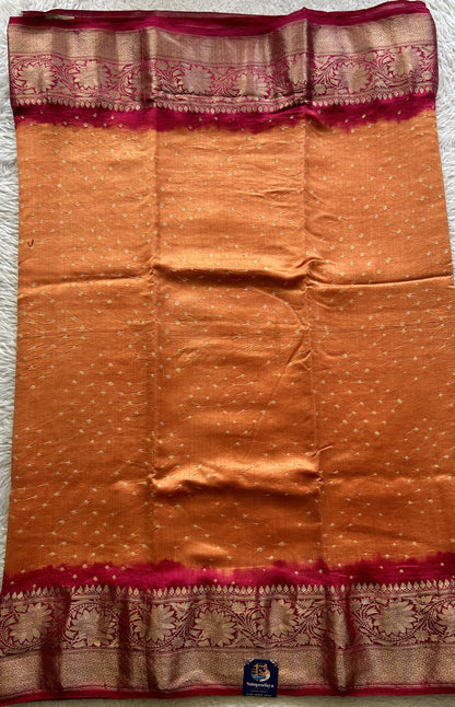 Bandhani Saree Orange Colored Elegantly Paired with a Dark Pink Color Zari Border. - Sampradaya Designer Studio