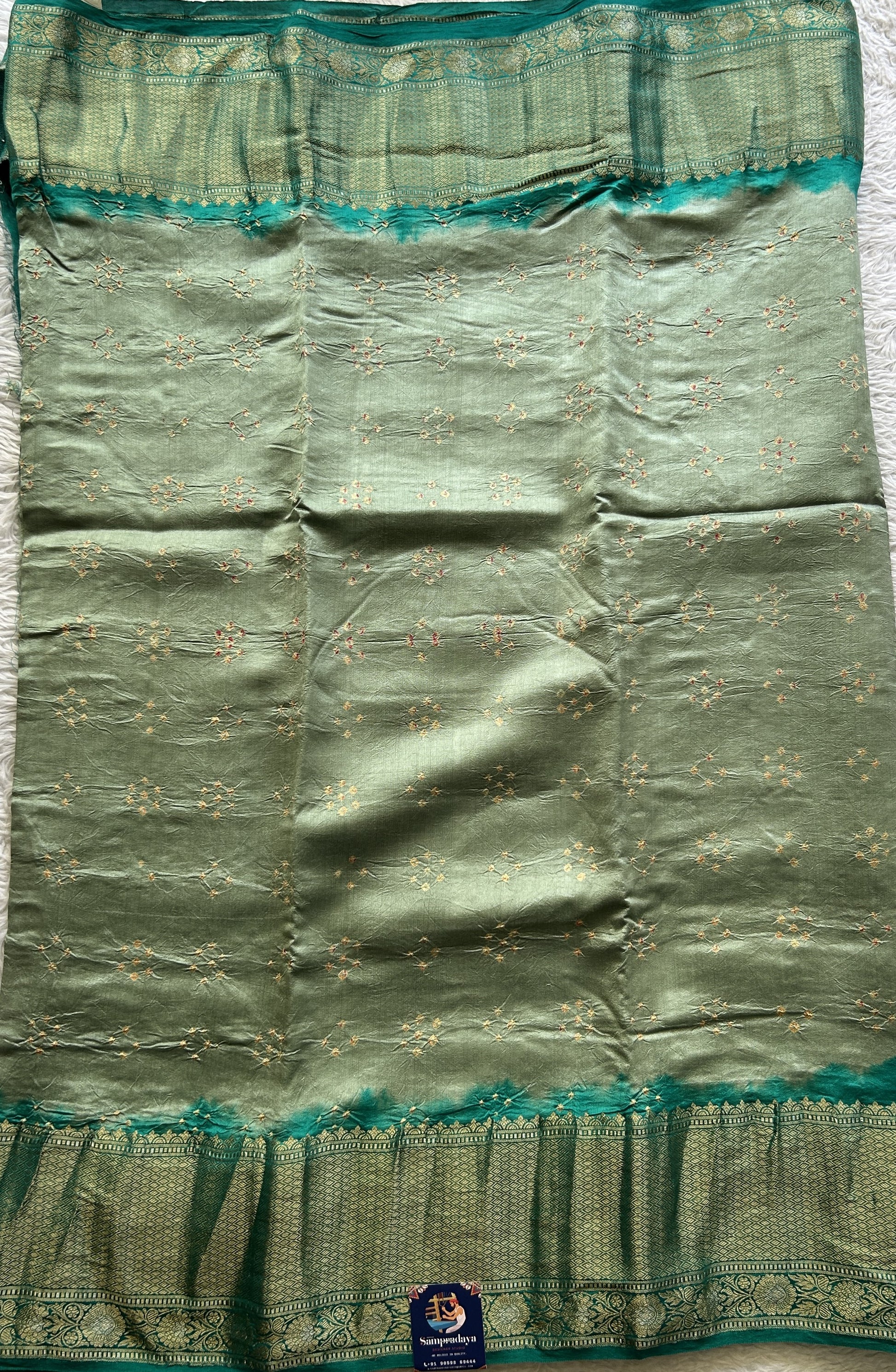 Bandhani Saree Miami Buff Colored Elegantly Paired with a Rama Green Color Zari Border. - Sampradaya Designer Studio