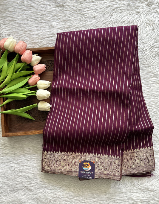 Semi Georgette Saree Purple Colored Complemented with a Zari Border. - Sampradaya Designer Studio