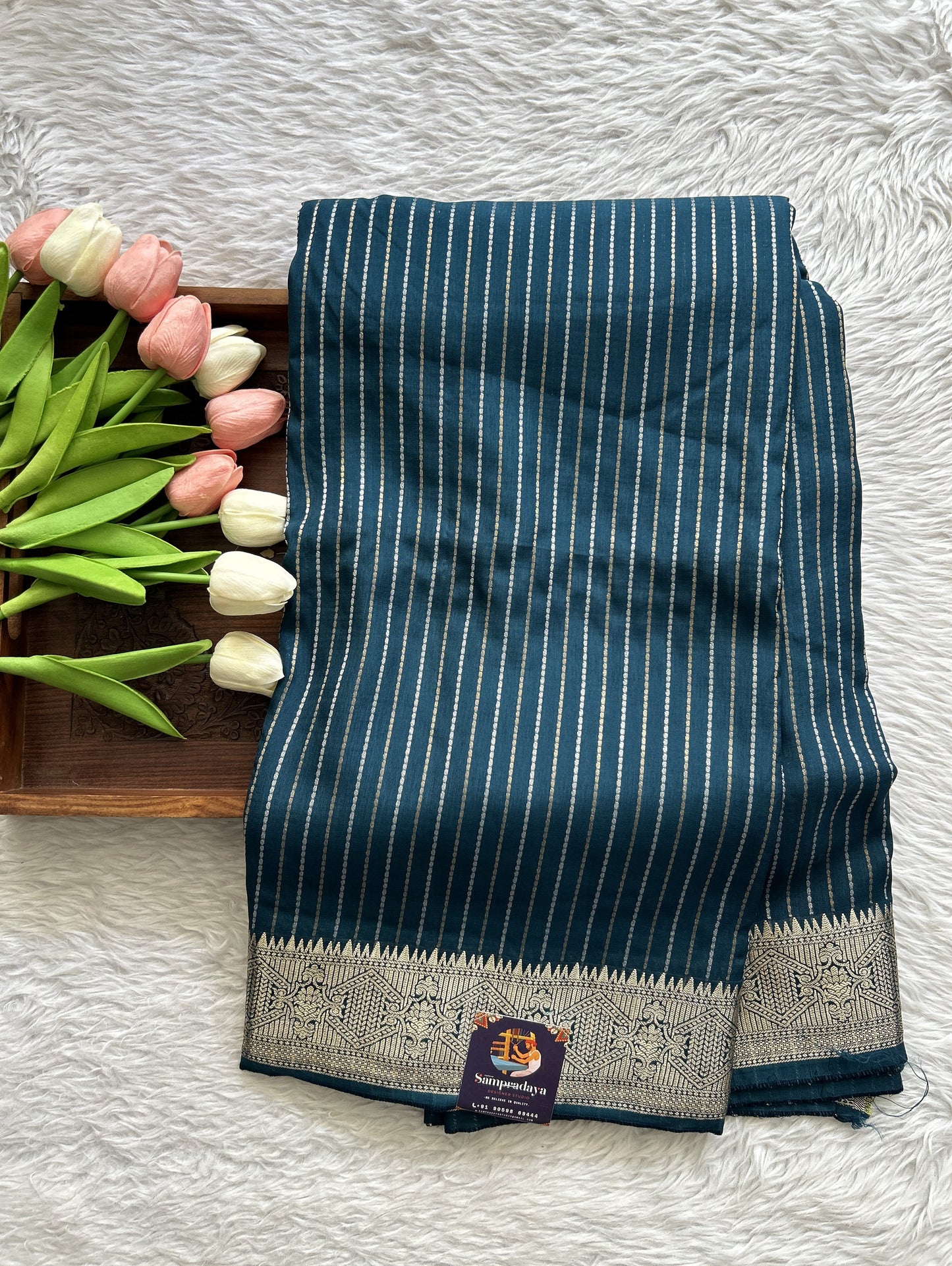Semi Georgette Saree Peacock Blue Colored Complemented with a Zari Border. - Sampradaya Designer Studio