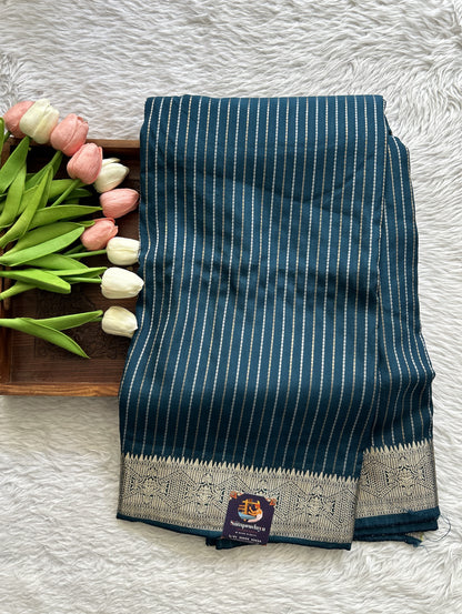 Semi Georgette Saree Peacock Blue Colored Complemented with a Zari Border. - Sampradaya Designer Studio