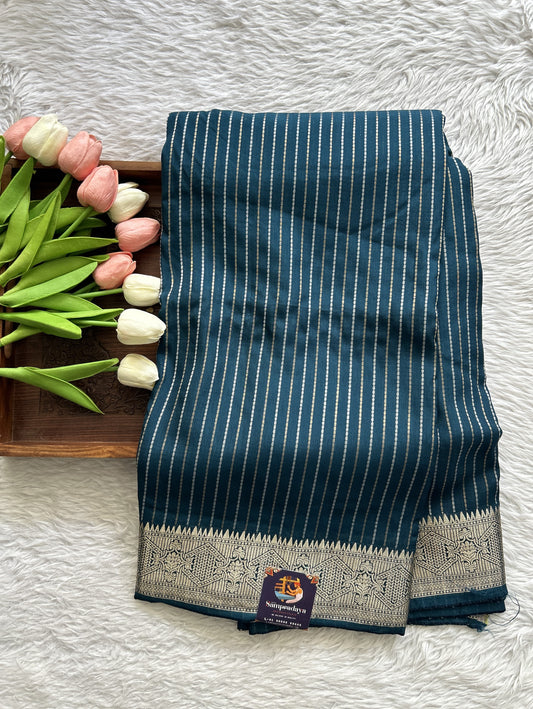 Semi Georgette Saree Peacock Blue Colored Complemented with a Zari Border. - Sampradaya Designer Studio