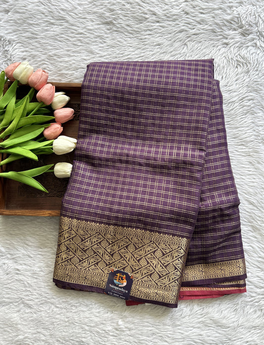 Semi Georgette Saree Purple Colored Complemented with a Zari Border. - Sampradaya Designer Studio