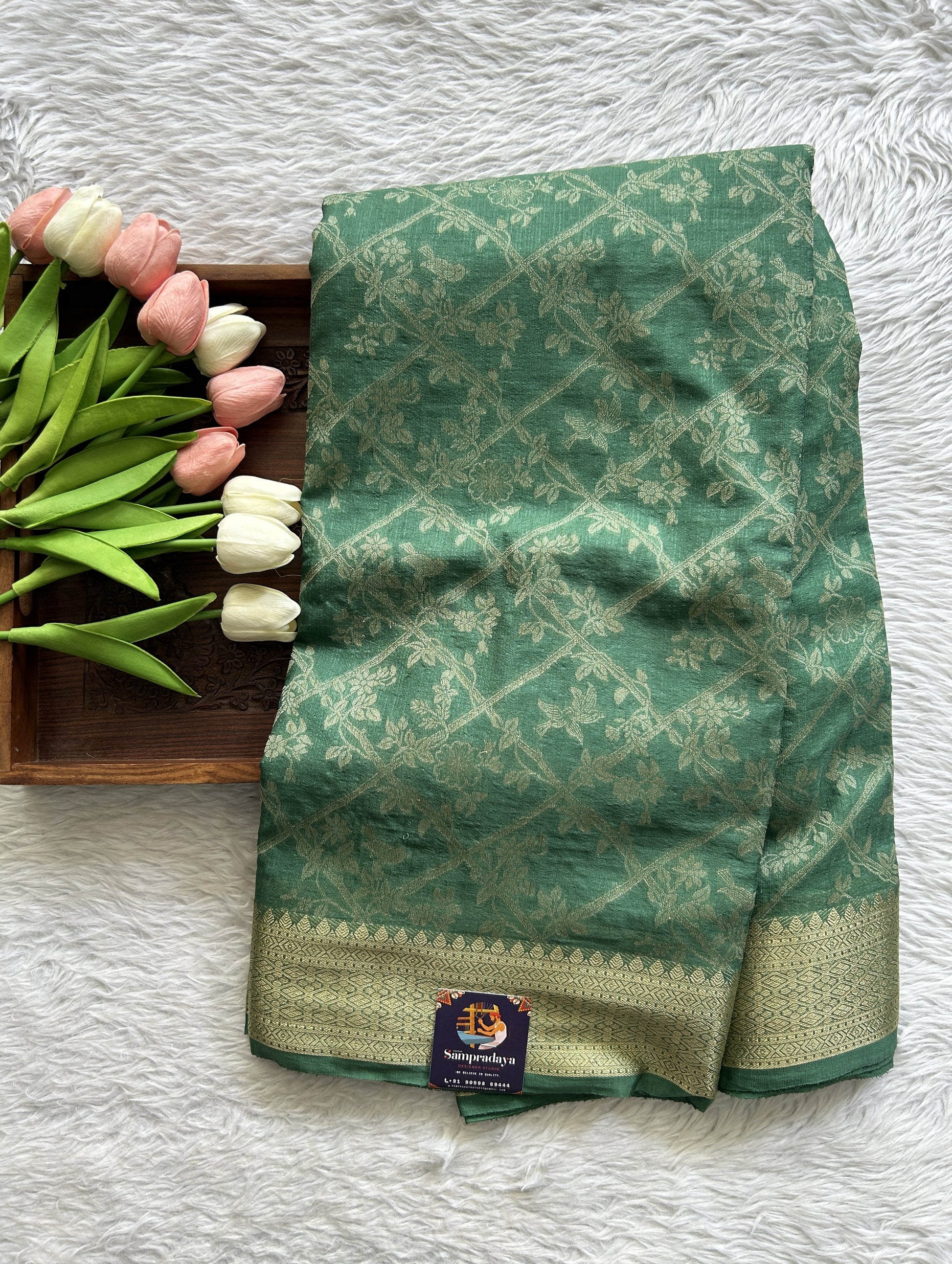 Semi Georgette Saree Green Colored Complemented with a Zari Border. - Sampradaya Designer Studio