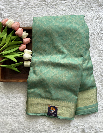 Semi Georgette Saree Light Green Colored Complemented with a Zari Border. - Sampradaya Designer Studio