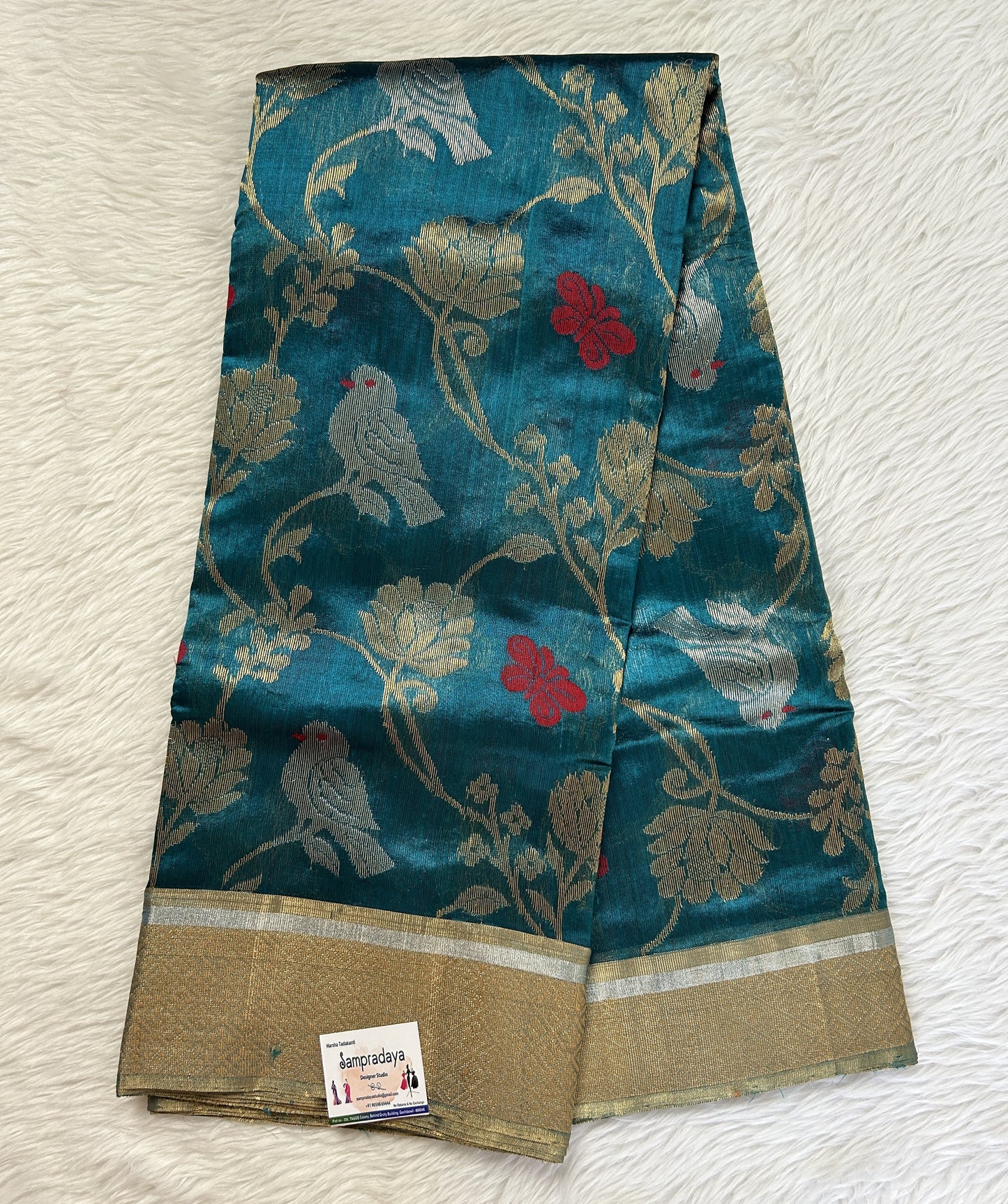 Chanderi Pattu Saree Teal Blue colored saree complemented with a Gold Zari border - Sampradaya Designer Studio