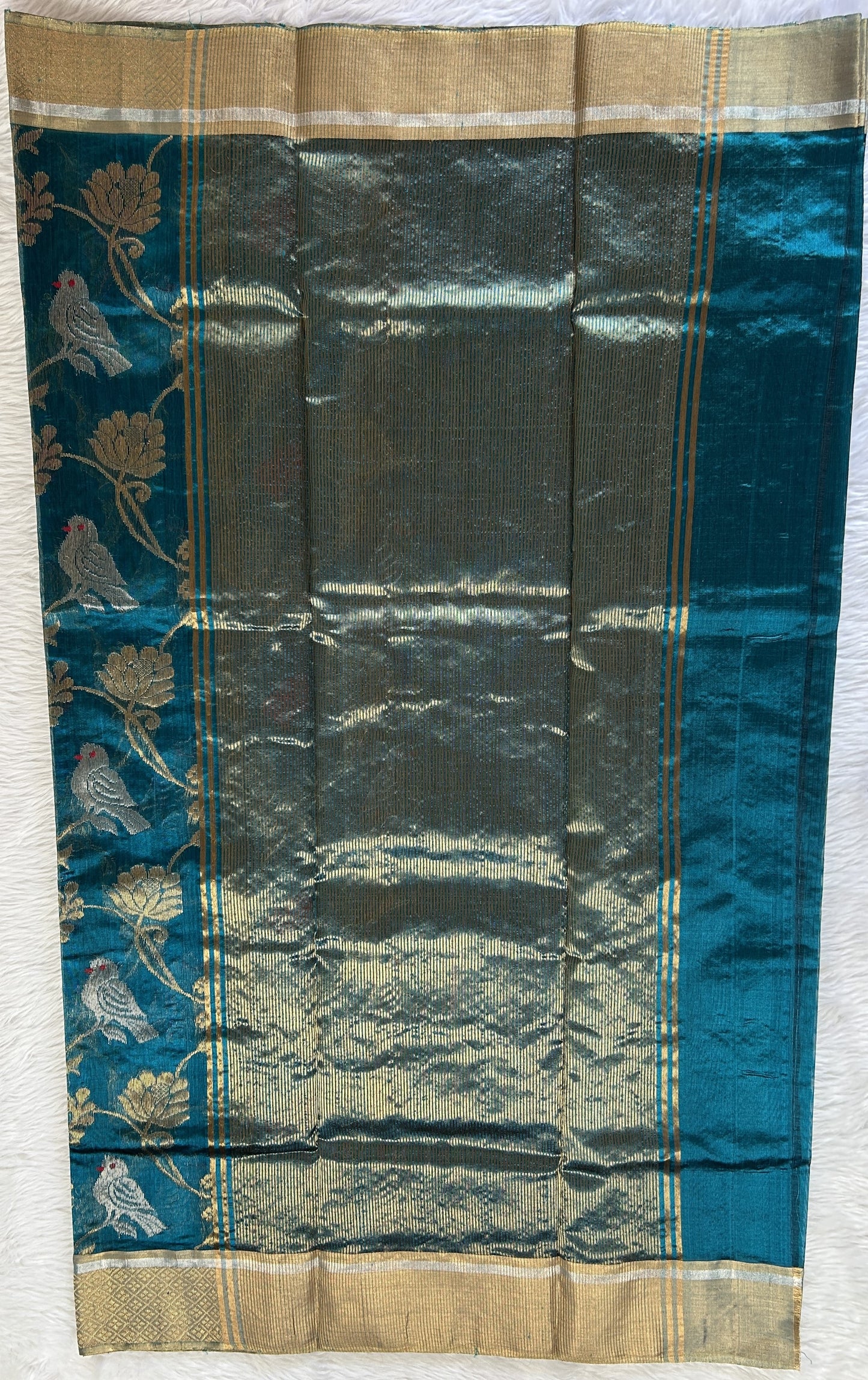 Chanderi Pattu Saree Teal Blue colored saree complemented with a Gold Zari border - Sampradaya Designer Studio