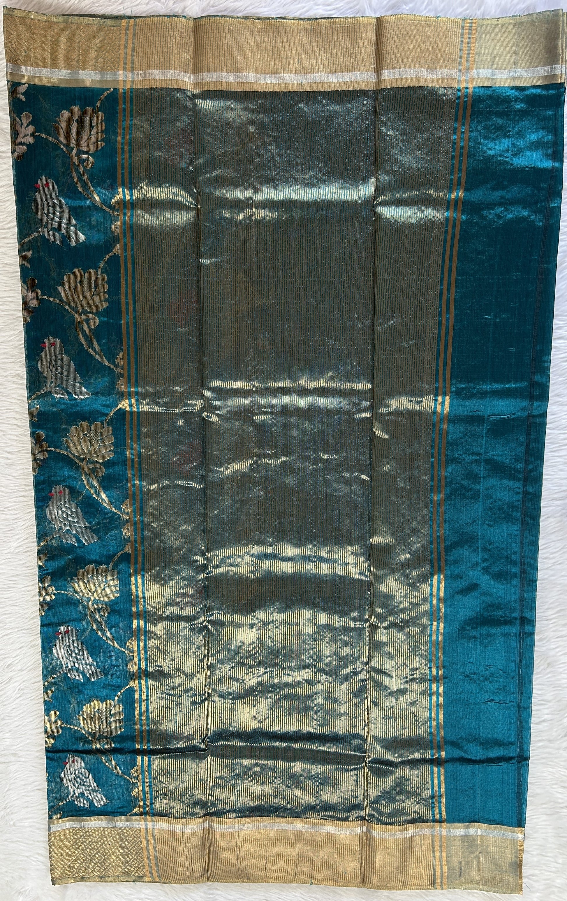 Chanderi Pattu Saree Teal Blue colored saree complemented with a Gold Zari border - Sampradaya Designer Studio