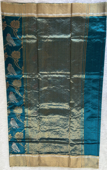 Chanderi Pattu Saree Teal Blue colored saree complemented with a Gold Zari border - Sampradaya Designer Studio