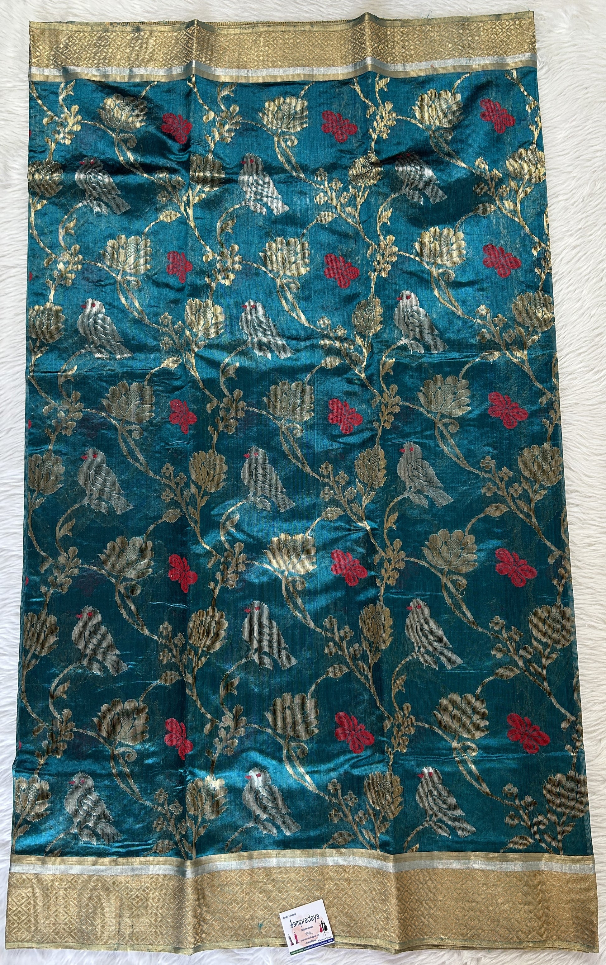 Chanderi Pattu Saree Teal Blue colored saree complemented with a Gold Zari border - Sampradaya Designer Studio
