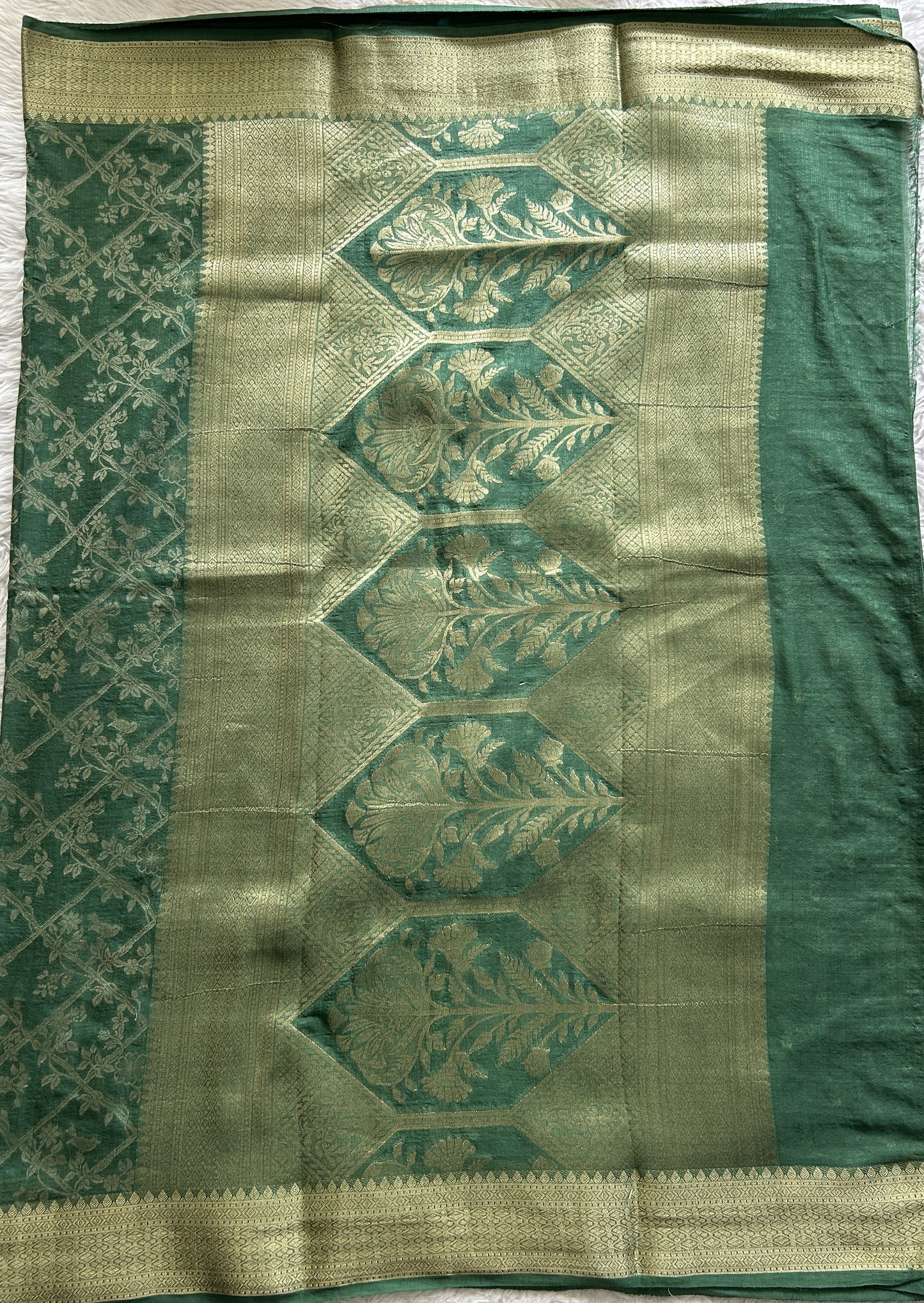 Semi Georgette Saree Green Colored Complemented with a Zari Border. - Sampradaya Designer Studio