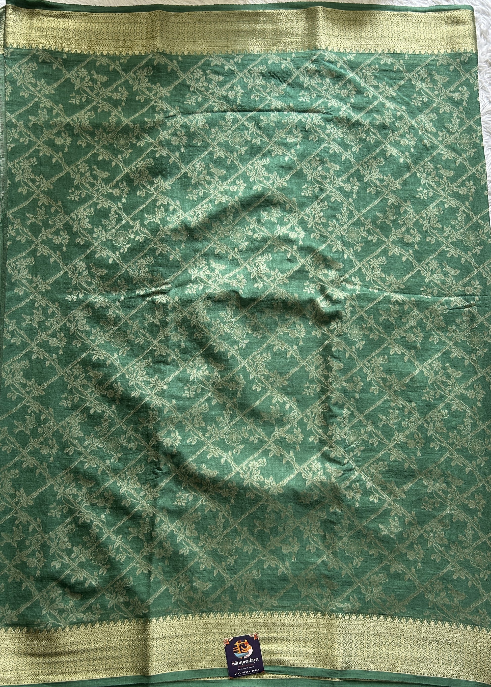 Semi Georgette Saree Green Colored Complemented with a Zari Border. - Sampradaya Designer Studio