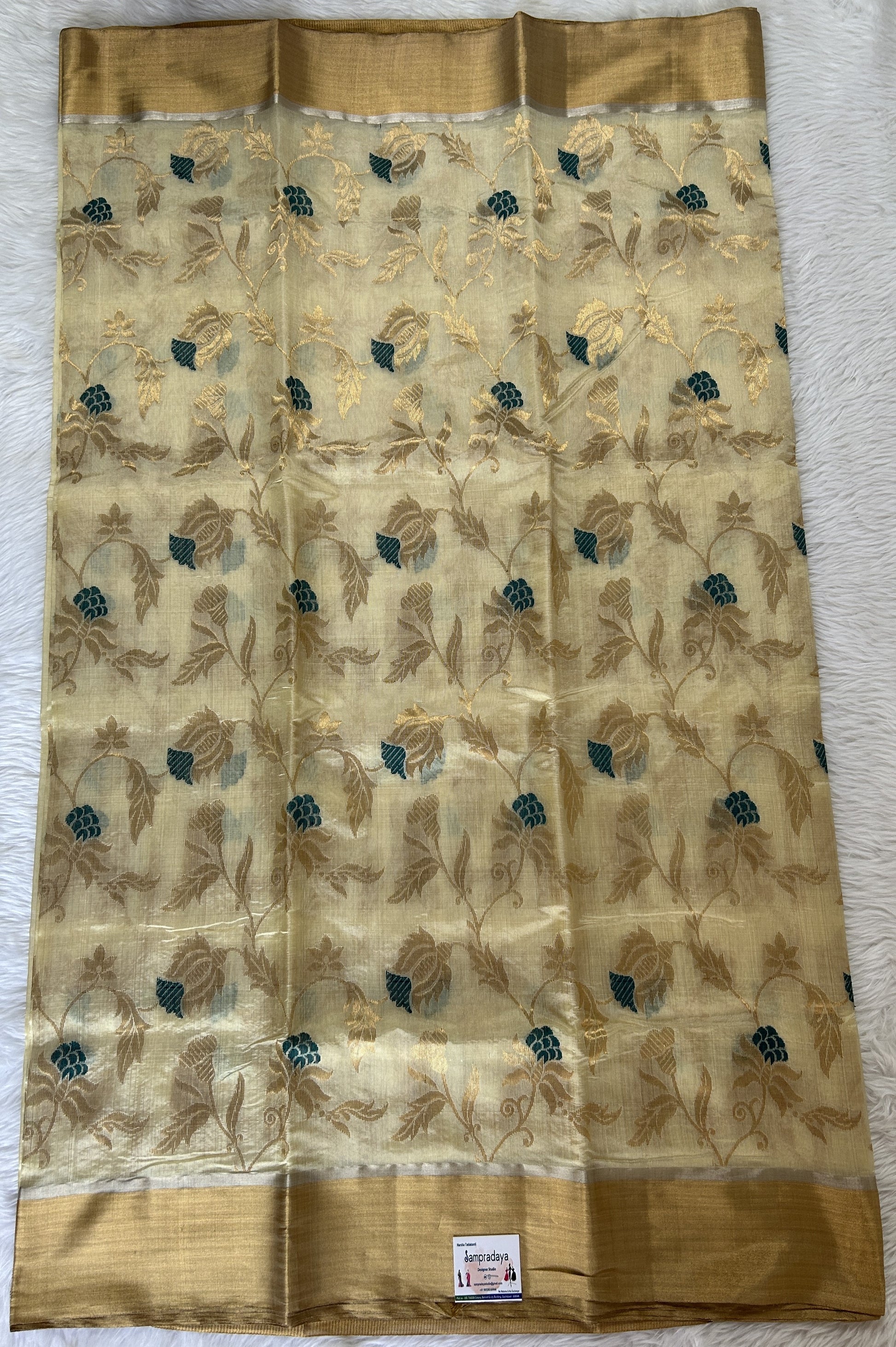 Chanderi Pattu Saree Cream colored saree complemented with a Gold Zari border - Sampradaya Designer Studio