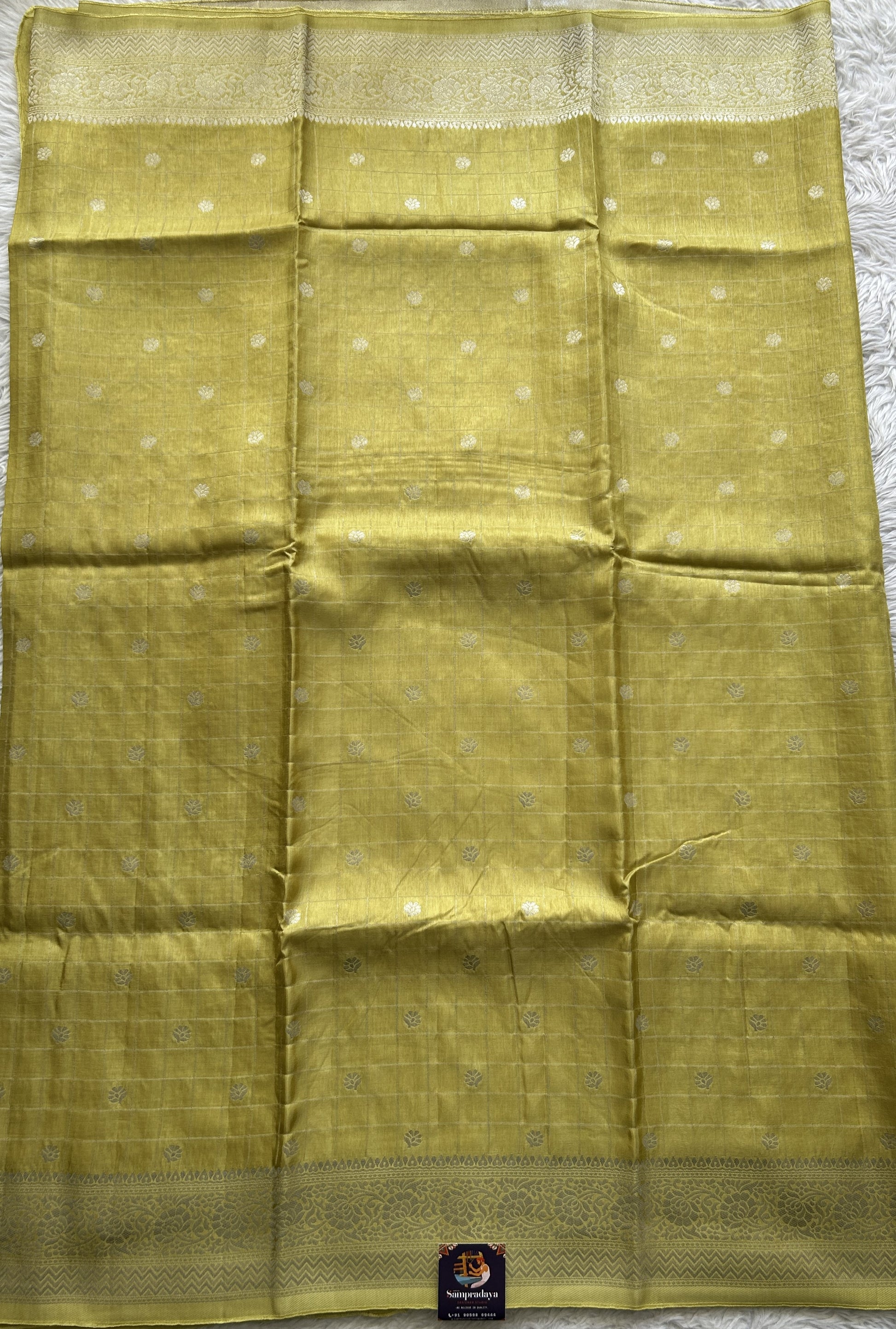 Semi Georgette Saree Yellow Colored Complemented with a Zari Border. - Sampradaya Designer Studio