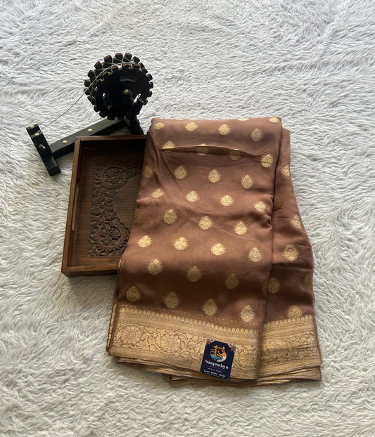 Semi Georgette Saree Peanut Colored Elegantly Paired with a Zari Border. - Sampradaya Designer Studio