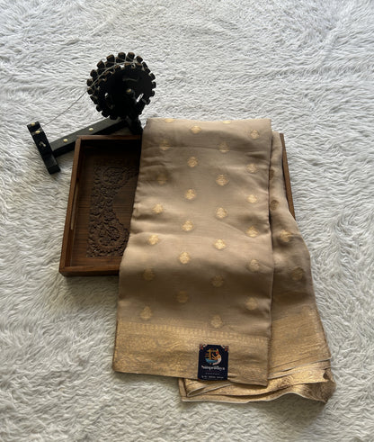 Semi Georgette Saree Oat Colored Elegantly Paired with a Zari Border. - Sampradaya Designer Studio