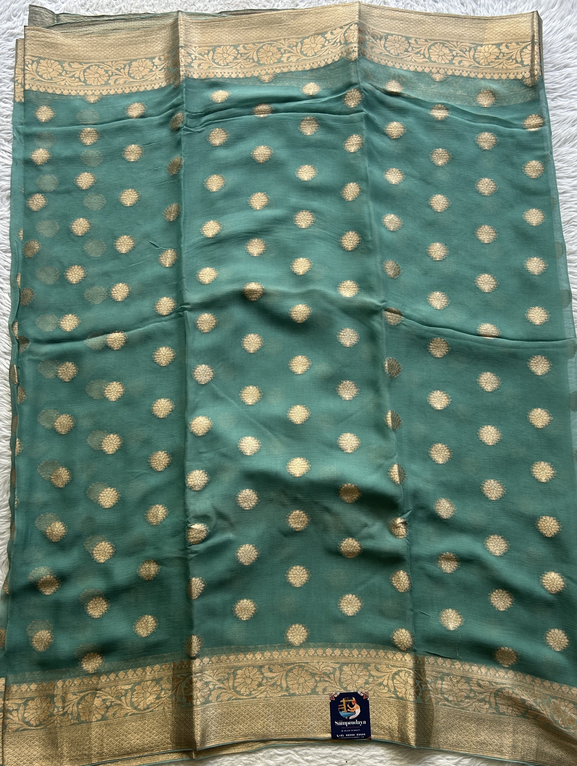 Semi Georgette Saree Dark Sea Green Colored Elegantly Paired with a Zari Border. - Sampradaya Designer Studio