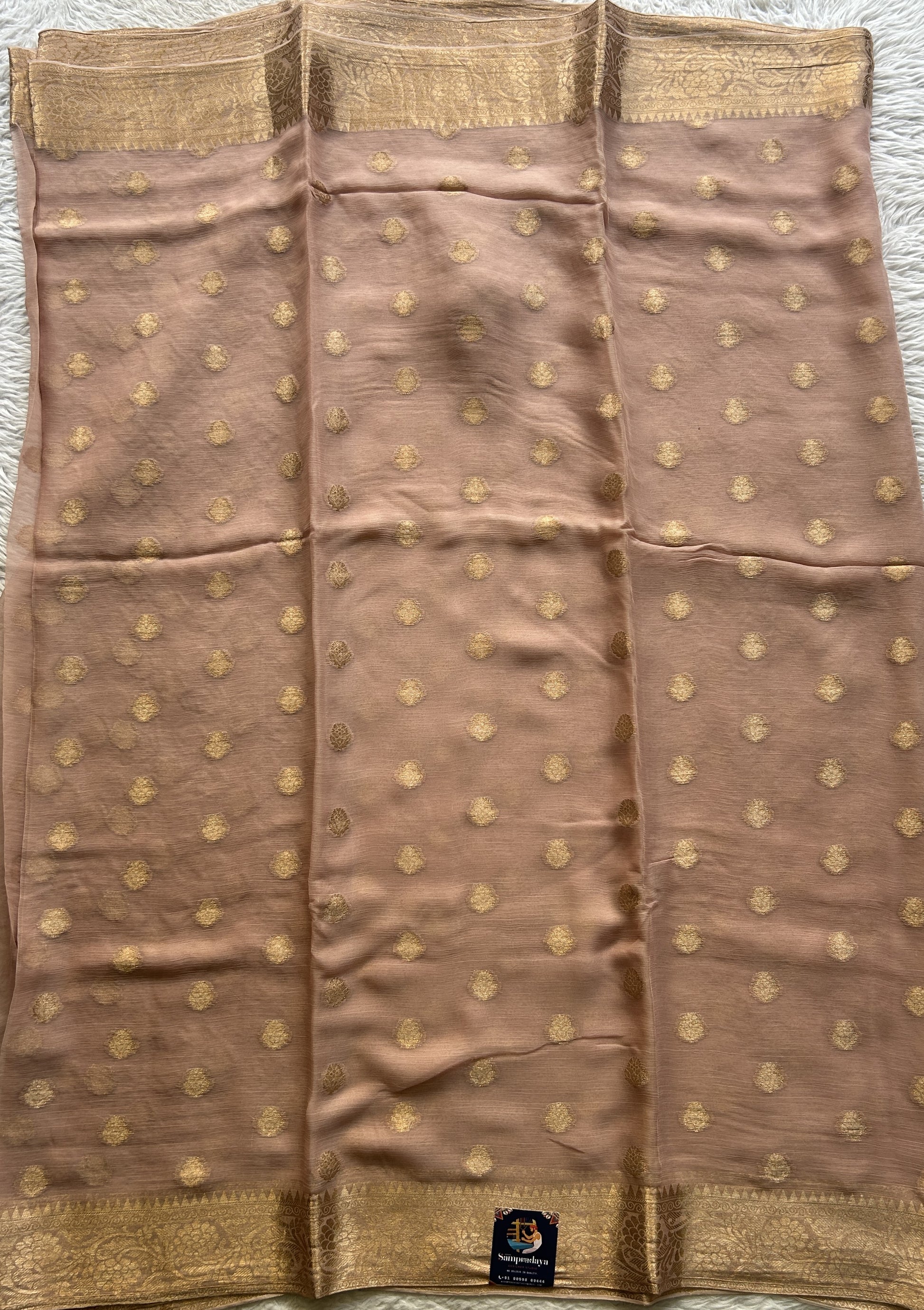 Semi Georgette Saree Very Light Peach Colored Elegantly Paired with a Zari Border. - Sampradaya Designer Studio