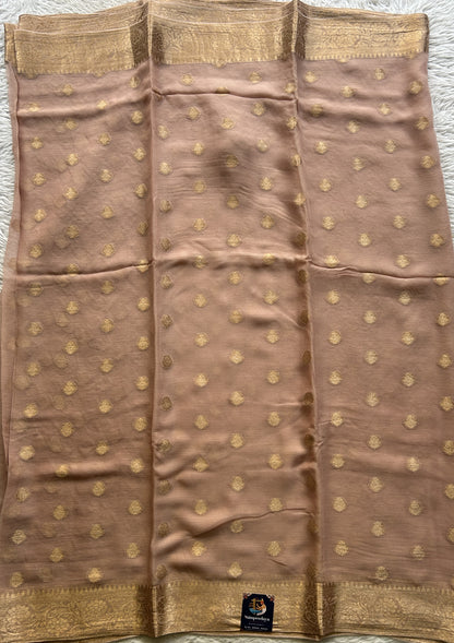 Semi Georgette Saree Very Light Peach Colored Elegantly Paired with a Zari Border. - Sampradaya Designer Studio