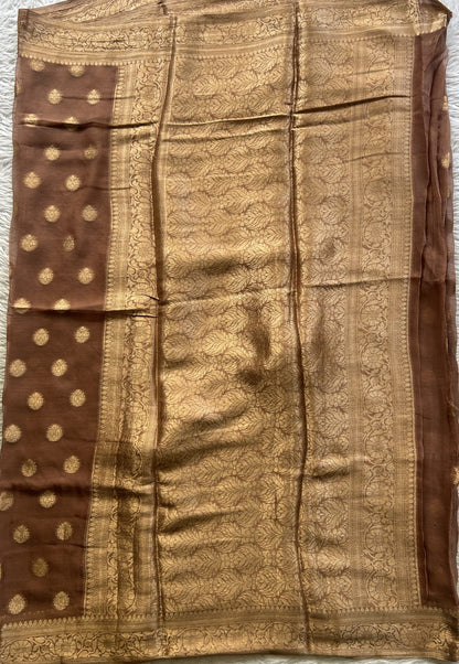 Semi Georgette Saree Peanut Colored Elegantly Paired with a Zari Border. - Sampradaya Designer Studio