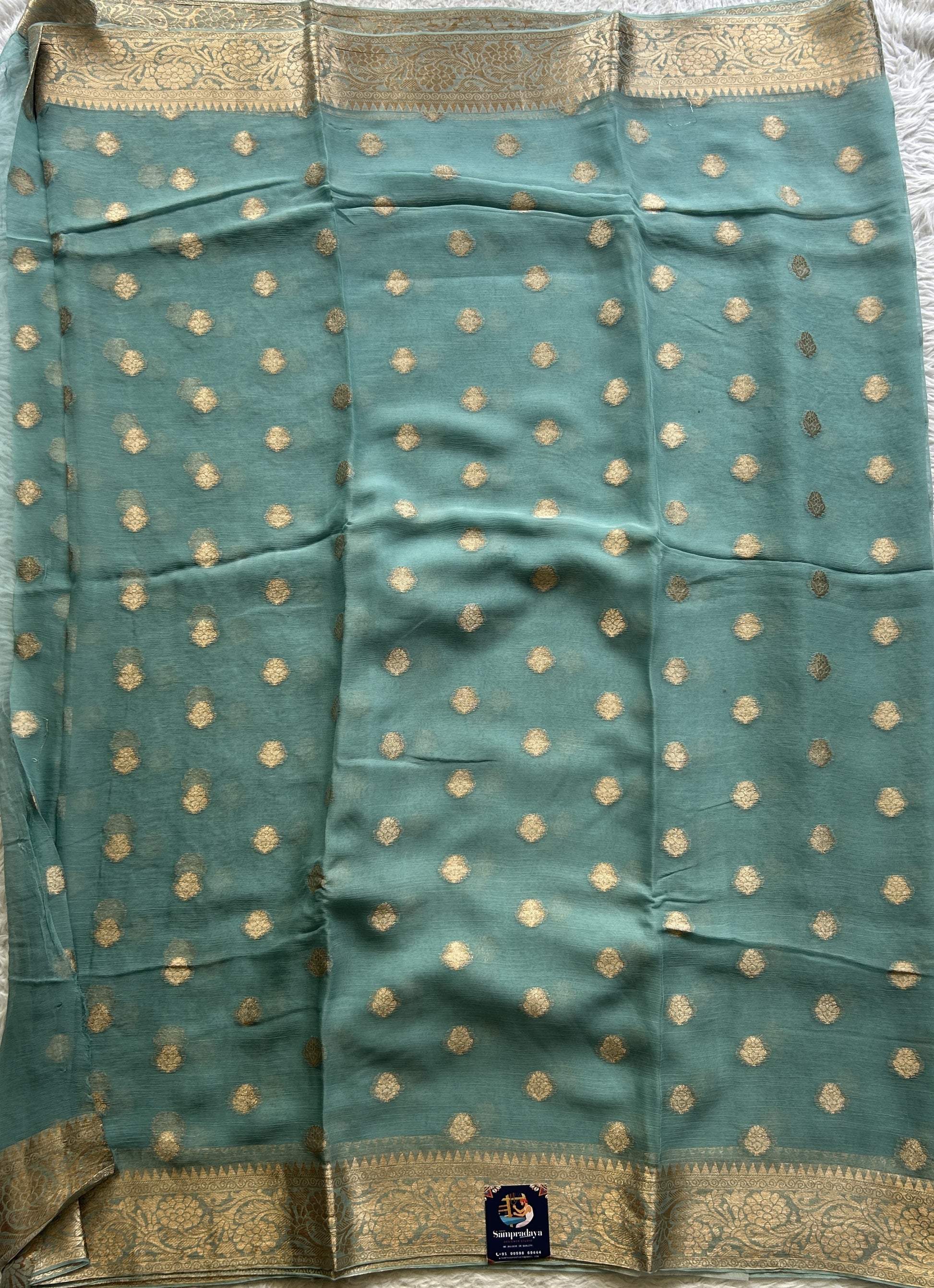 Semi Georgette Saree Sky Blue Colored Elegantly Paired with a Zari Border. - Sampradaya Designer Studio