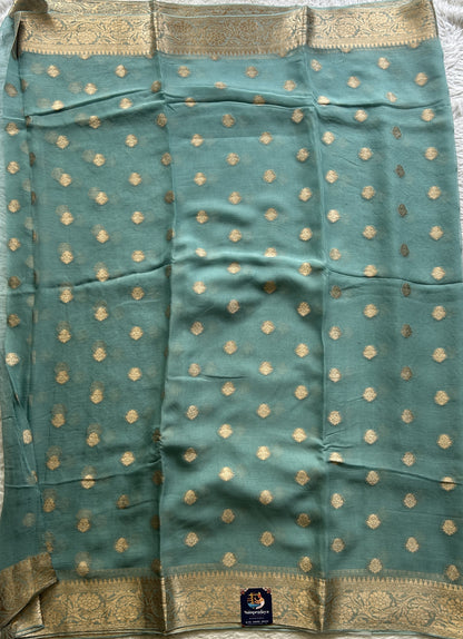 Semi Georgette Saree Sky Blue Colored Elegantly Paired with a Zari Border. - Sampradaya Designer Studio