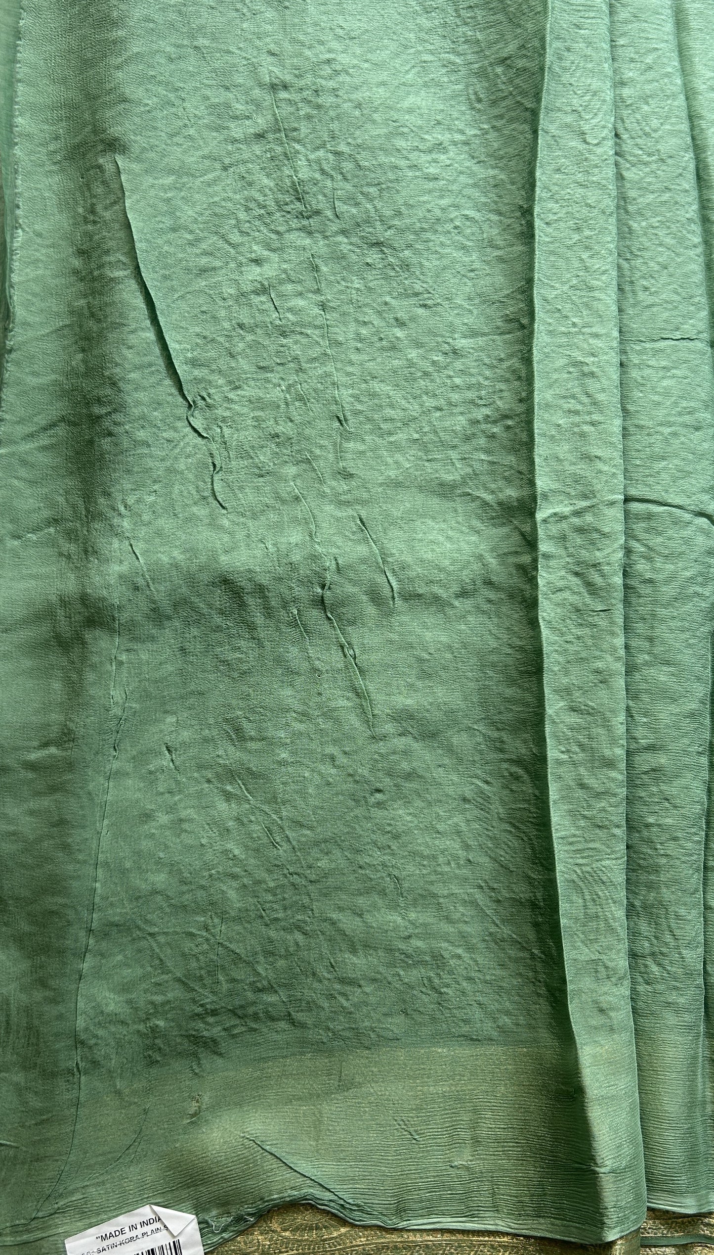 Semi Georgette Saree Jade Green Colored Elegantly Paired with a Zari Border. - Sampradaya Designer Studio