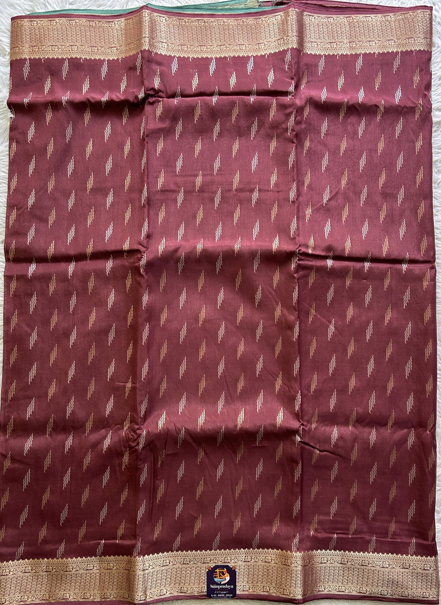 Semi Georgette Saree Burgundy Colored Complemented with a Zari Border. - Sampradaya Designer Studio