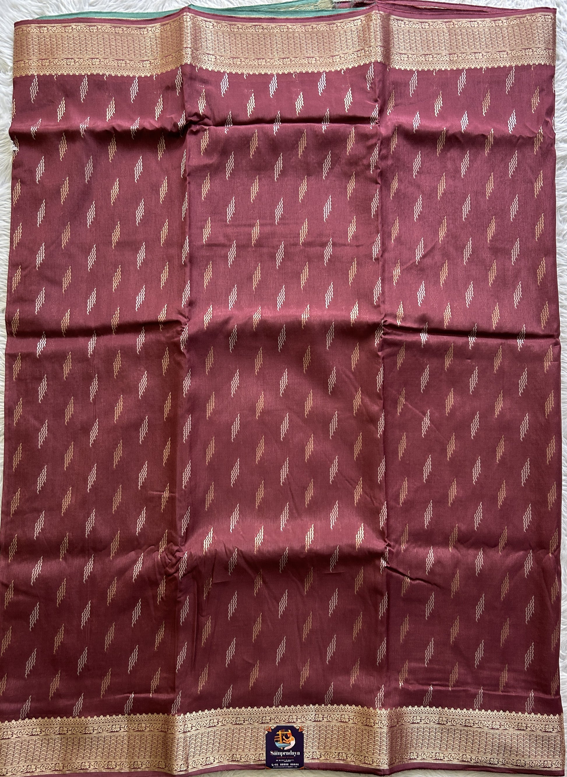Semi Georgette Saree Burgundy Colored Complemented with a Zari Border. - Sampradaya Designer Studio