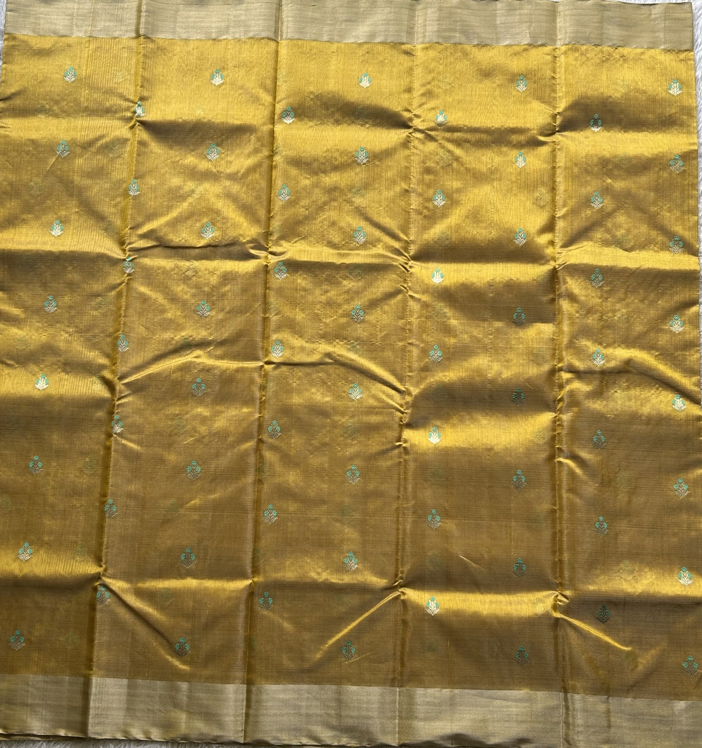 Chanderi Tissue Saree  Amber color Elegantly Paired with a Silver Zari Border - Sampradaya Designer Studio