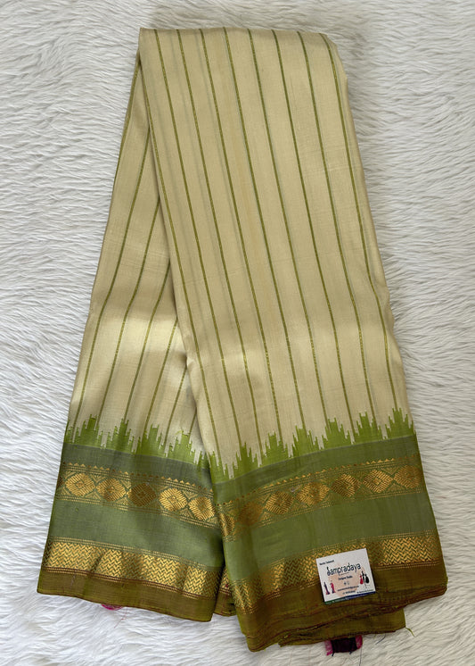 Gadwal Pattu Saree Cream Colored with Parrot Green Vertical lines Saree Complemented With a Pattu Parrot Green Color Kanchi Gap Border - Sampradaya Designer Studio
