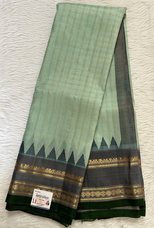 Gadwal Pattu Saree Pastel Green Colored Checks Saree Complemented With a Pattu Black Color Kanchi Gap Border - Sampradaya Designer Studio