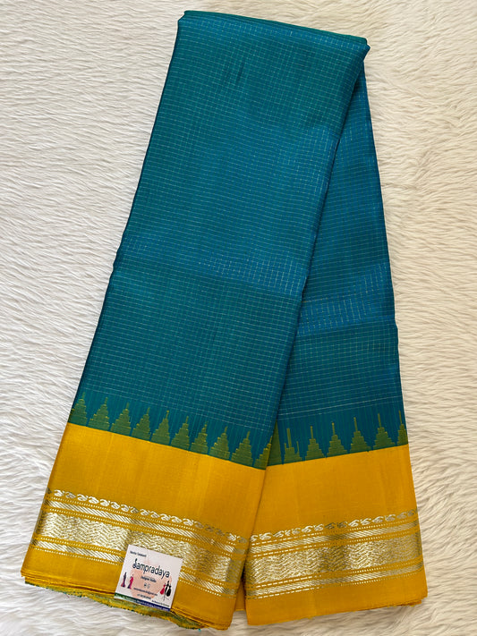 Gadwal Pattu Saree Blue Colored Complemented With a Pattu Yellow Color Gap Border - Sampradaya Designer Studio