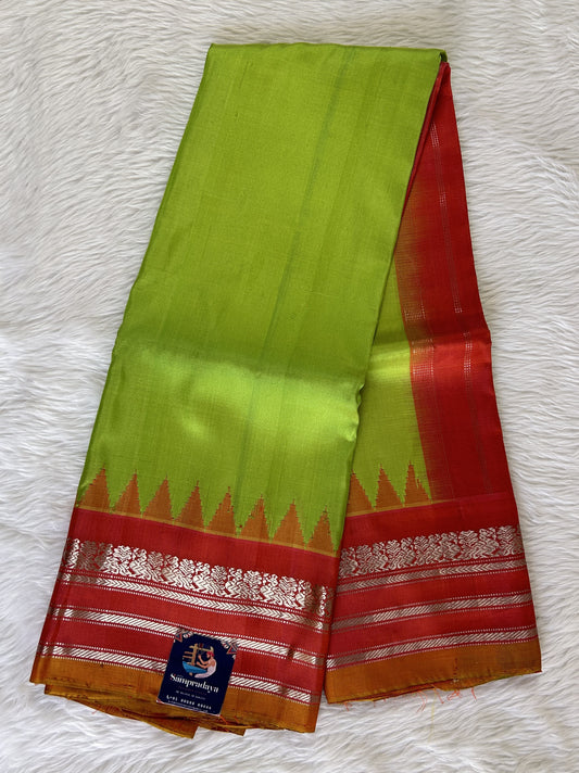 Gadwal Pattu Saree Parrot Green Colored Complemented With a Pattu Dark Peach Color Gap Border - Sampradaya Designer Studio