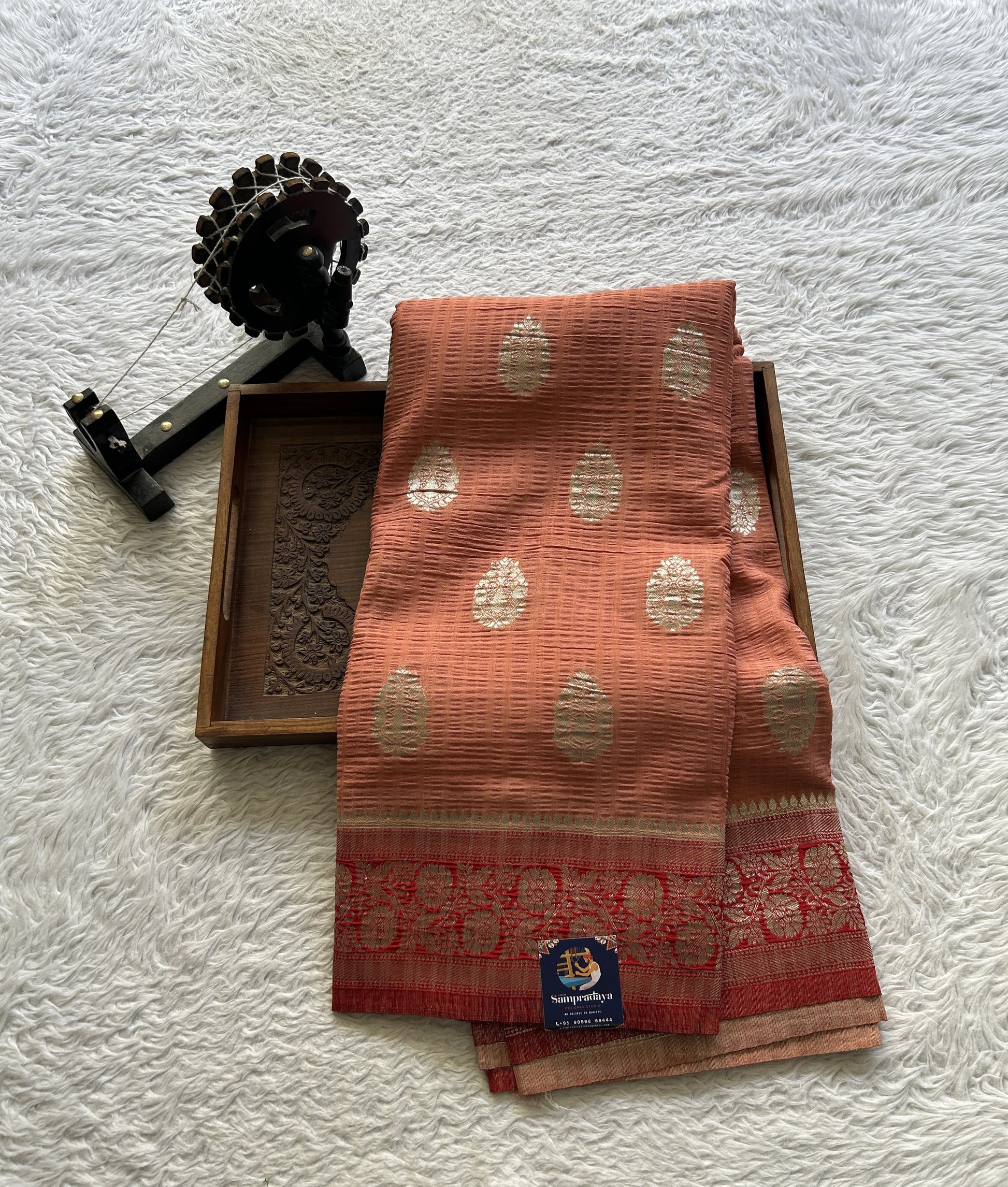 Semi Georgette Saree Pale Orange Colored Complemented with a Zari Border. - Sampradaya Designer Studio