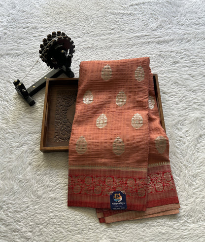 Semi Georgette Saree Pale Orange Colored Complemented with a Zari Border. - Sampradaya Designer Studio
