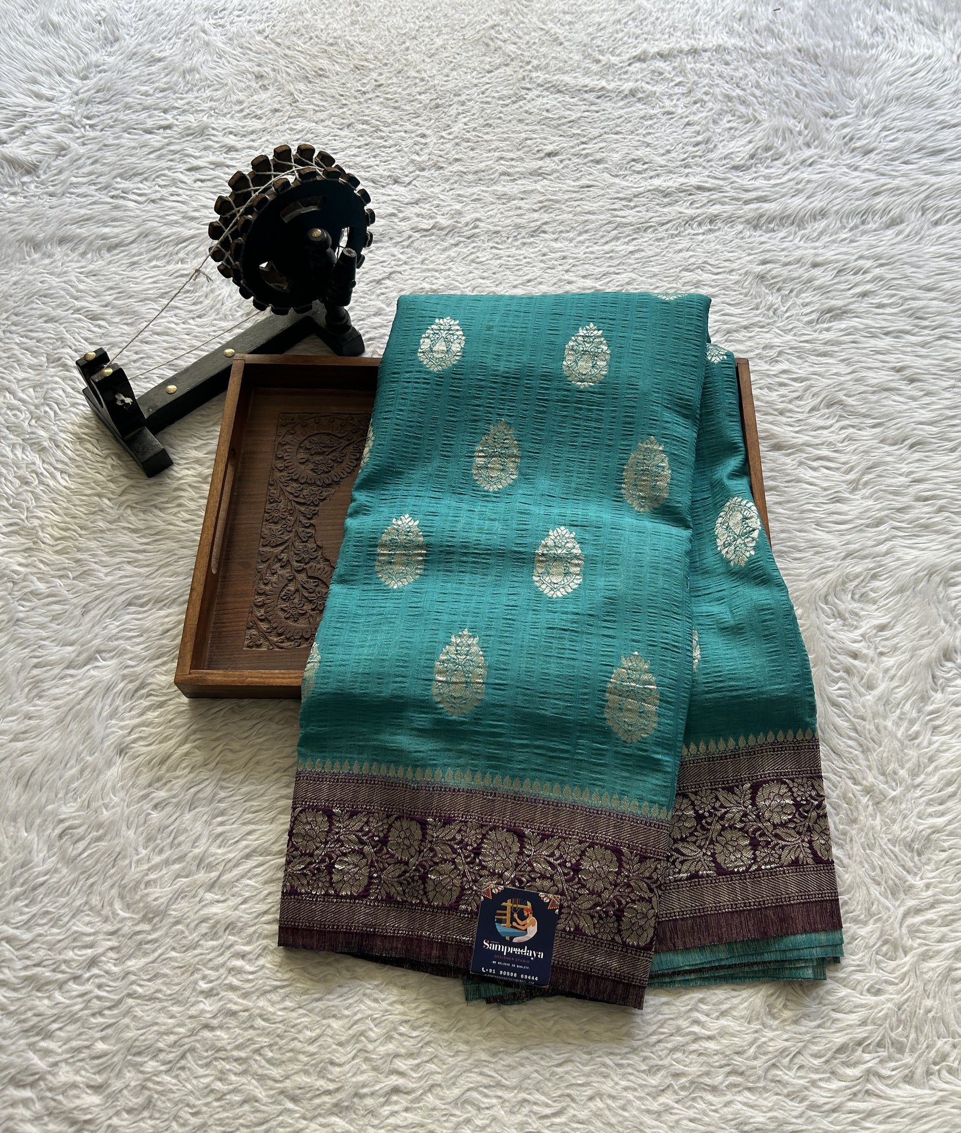 Semi Georgette Saree Aqua Blue Colored Complemented with a Purple Zari Border. - Sampradaya Designer Studio