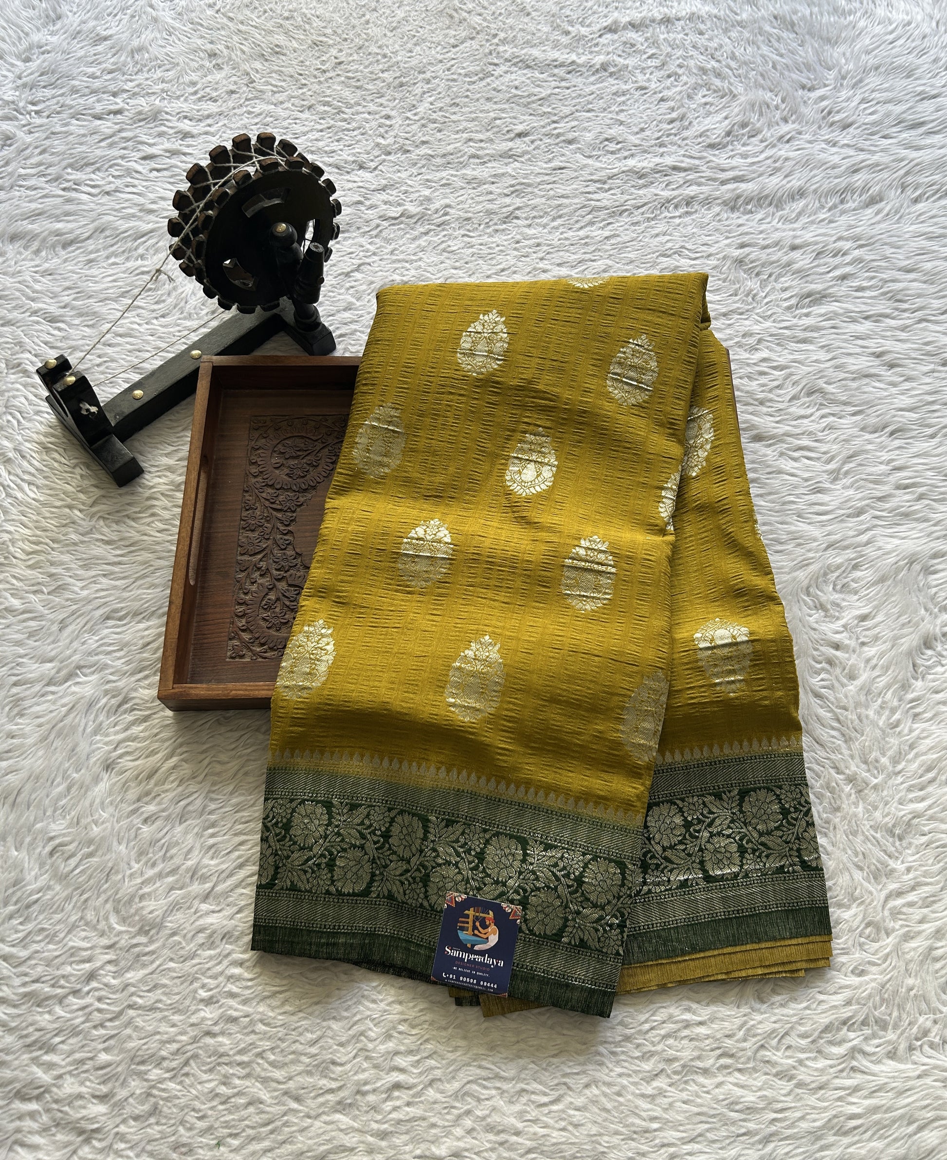 Semi Georgette Saree Mustard Colored Complemented with a Green Zari Border. - Sampradaya Designer Studio