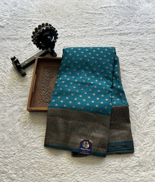 Semi Georgette Saree Teal Blue Colored Elegantly Paired with a Zari Border. - Sampradaya Designer Studio