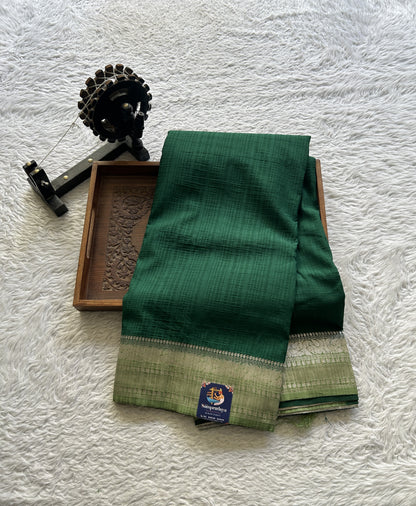 Semi Georgette Plain Saree Dark Green Colored Elegantly Paired with a Zari Border. - Sampradaya Designer Studio