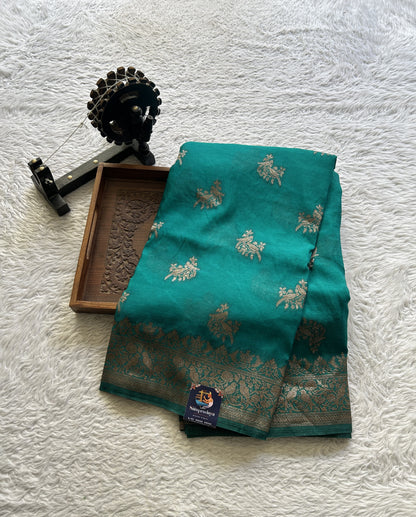 Semi Georgette Saree Turquoise Blue Colored Elegantly Paired with a Zari Border. - Sampradaya Designer Studio