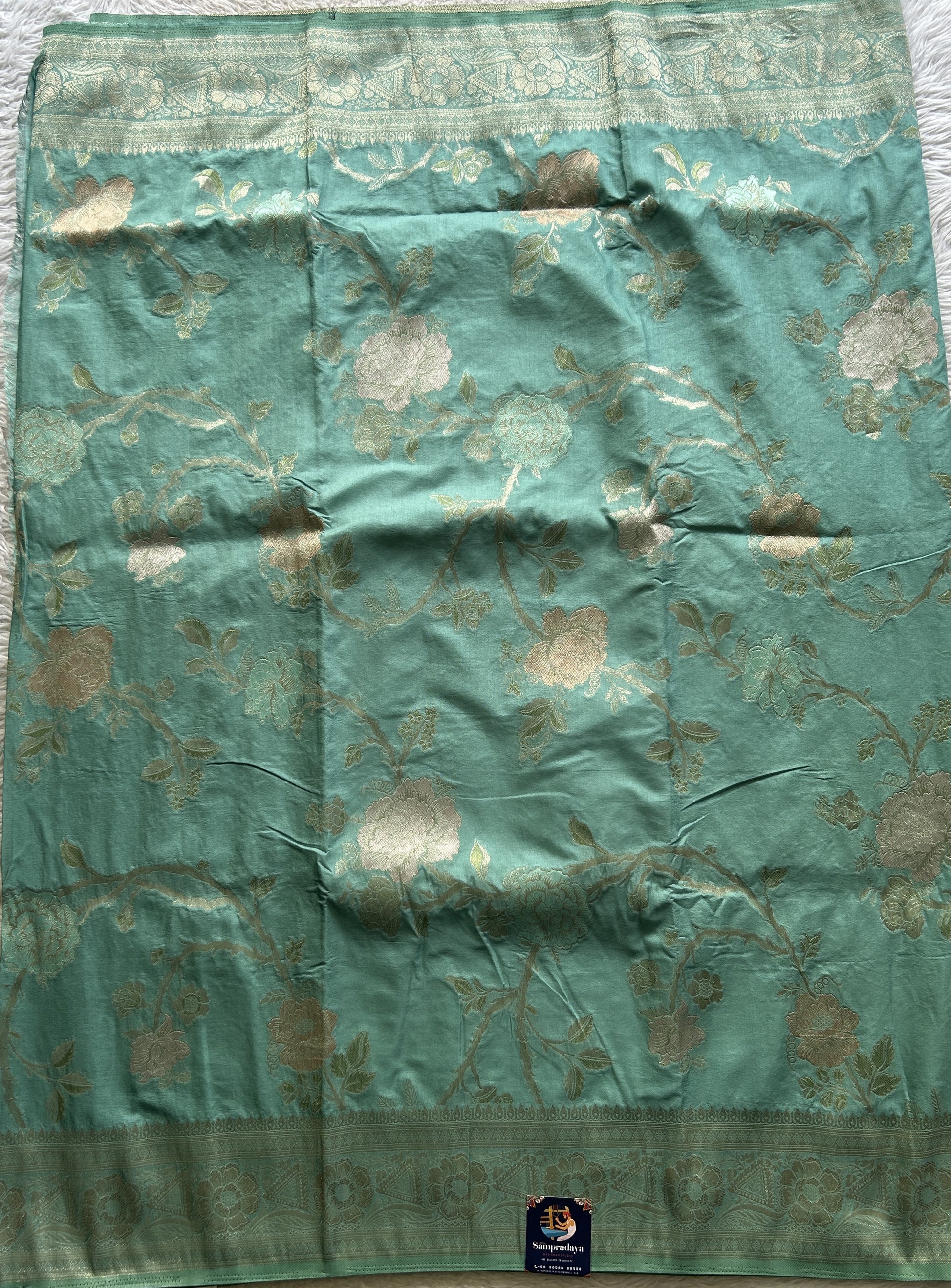 Semi Georgette Saree Light Sea Green Colored Elegantly Paired with a Zari Border. - Sampradaya Designer Studio