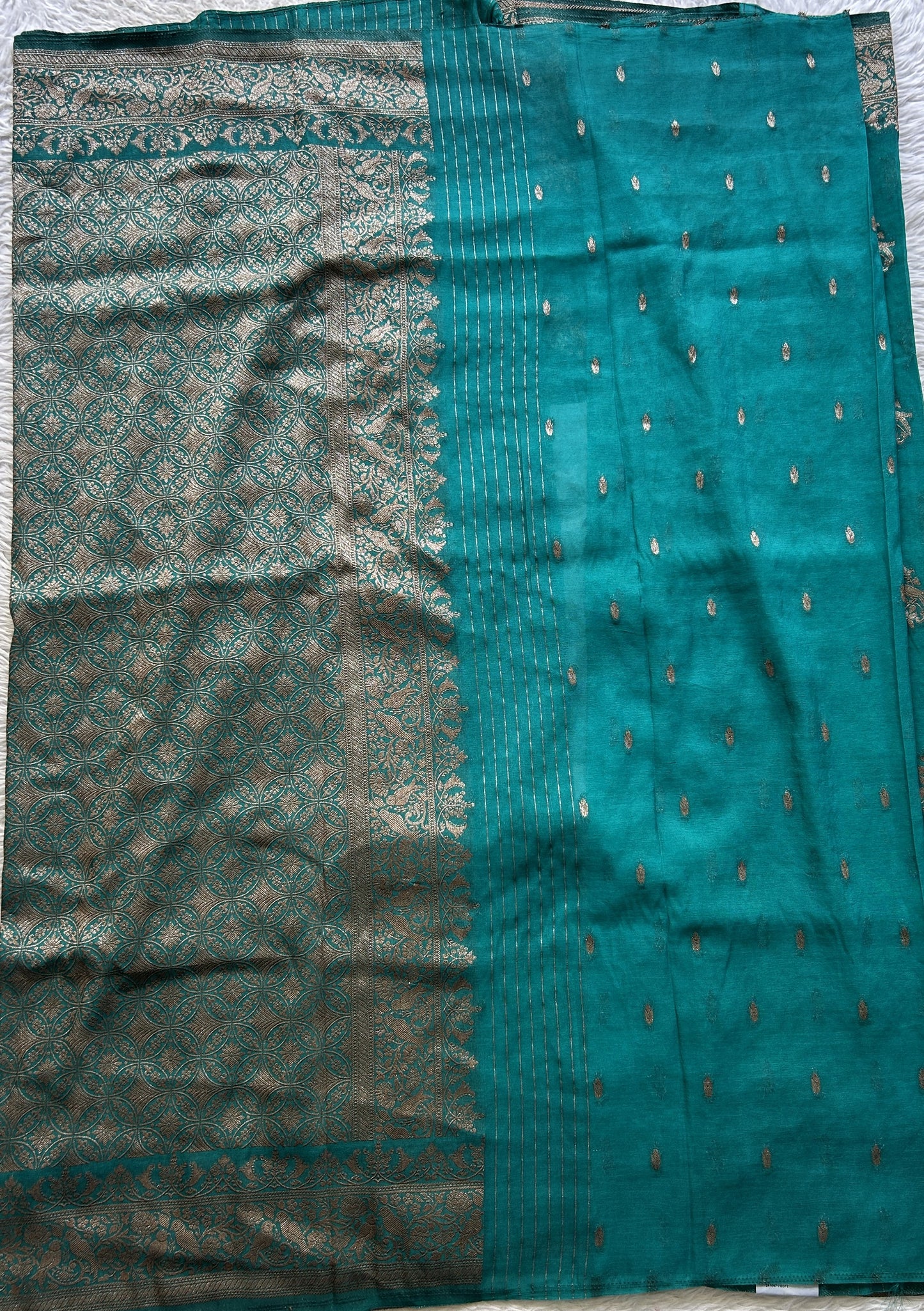 Semi Georgette Saree Turquoise Blue Colored Elegantly Paired with a Zari Border. - Sampradaya Designer Studio