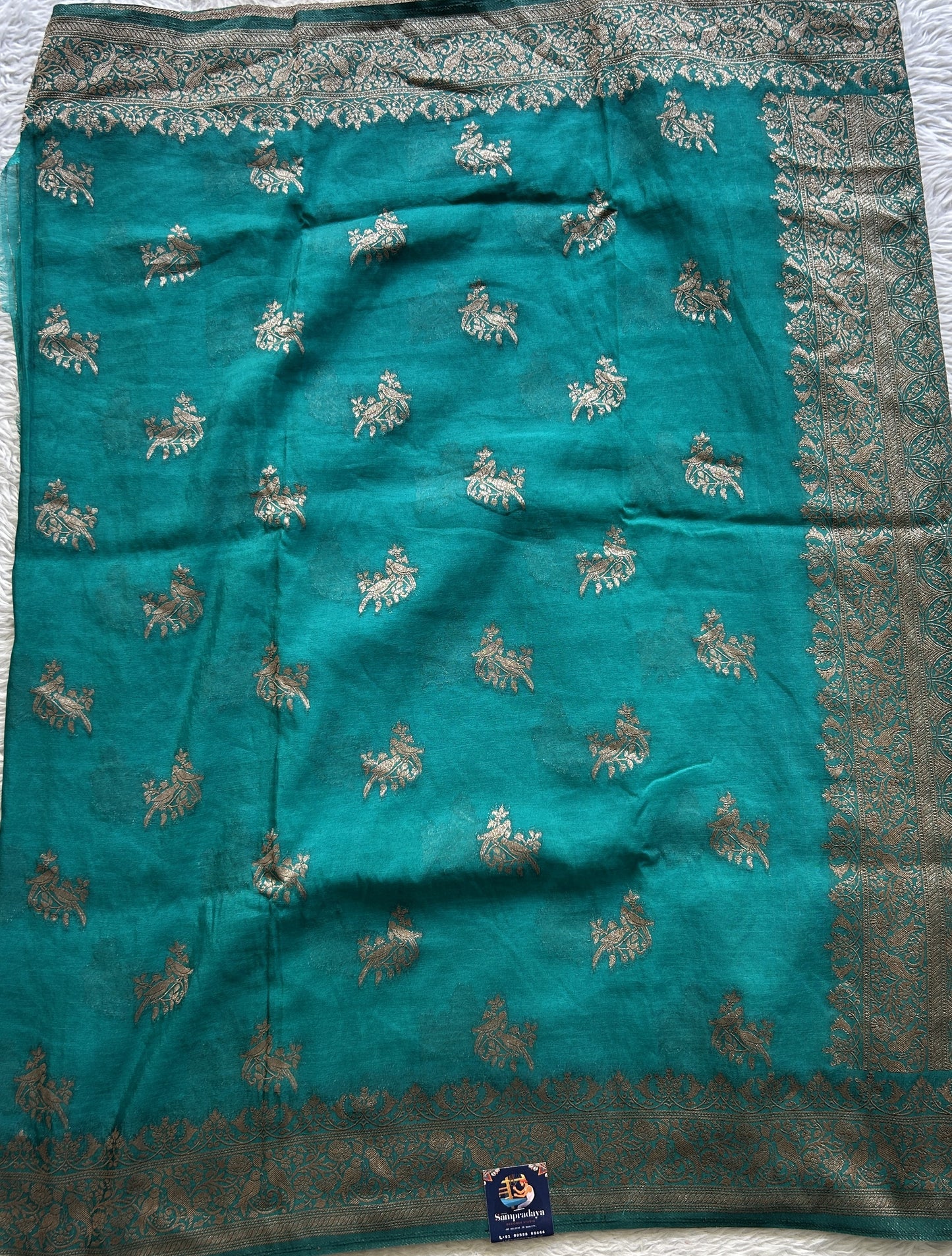 Semi Georgette Saree Turquoise Blue Colored Elegantly Paired with a Zari Border. - Sampradaya Designer Studio